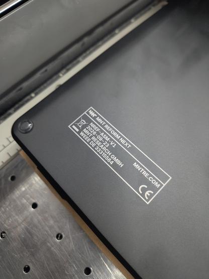closeup of laser engraved model number badge of mnt reform next